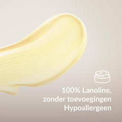Monster van gele lanolinecrème met een pictogram en de tekst '100% Lanoline, geen toevoegingen - Hypoallergeen'.