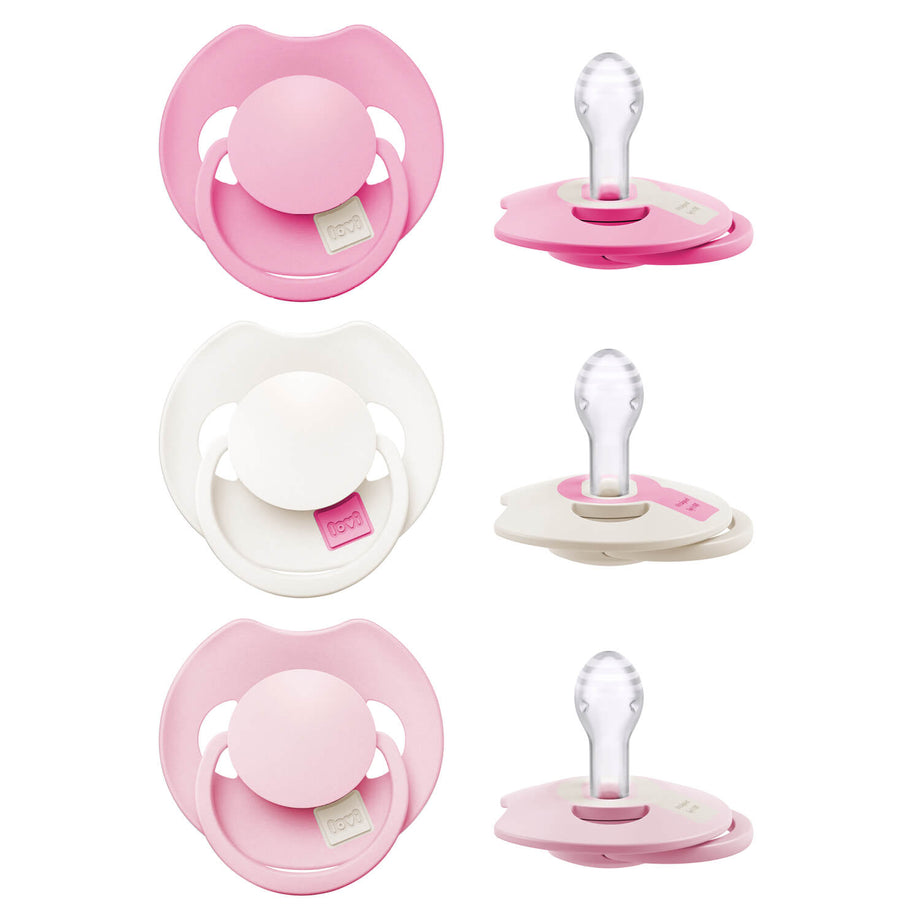 Drie LOVI Dynamic fopspenen 0–6 maanden Peony Pink in voor- en zijaanzicht met zichtbare siliconen speen