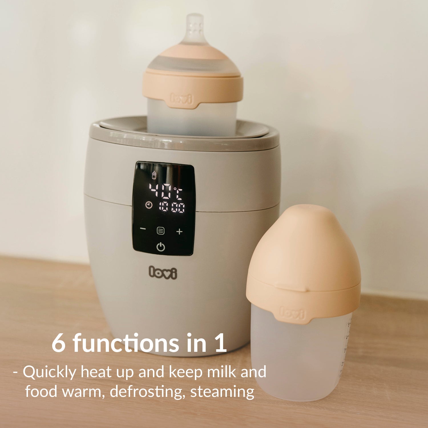 Foto van flessenwarmer met fles met korter uitleg van 6 in 1 functies